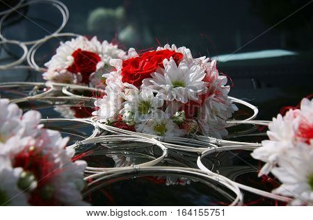 Flowers as a car weddding decoration. Shallow depth of field. Focus in the center.
