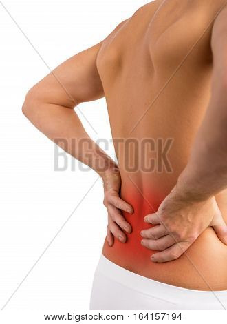 Man having lower back problems an holding his back
