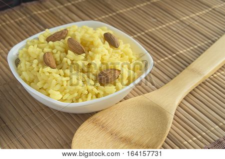 Traditional Indian Pongal, Makar Sankranti rice nuts almonds.