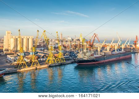 Casablanca Morocco - December 8 2016: Cargo vessel Ocean Luck (Bulk Carrier) early in the morning in the seaport of Casablanca Morocco. The scene with harbor cranes elevators ships and export cargoes in the port.