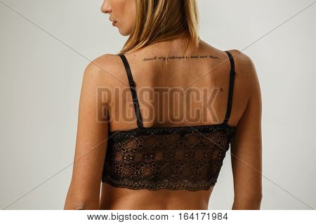 Beautiful sexy fitness blonde posing in lingerie on white background, catalog, book