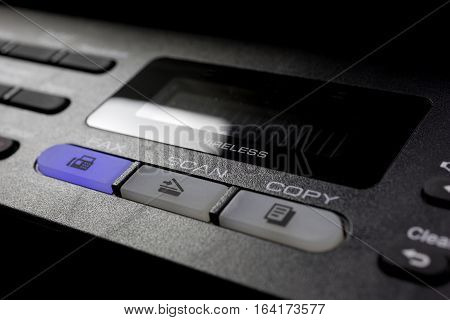 Copier Scan Button-Closeup 01 - Closeup photo of a copier-fax-scanner's menu selection buttons with dramatic lighting
