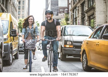 Couple of cyclist in New York - Couple of lovers sighseeing Manhattan on bikes
