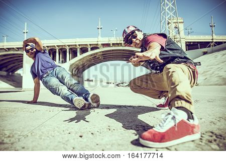 Two bbys ding some stunts - Street artist breakdancing outdrs