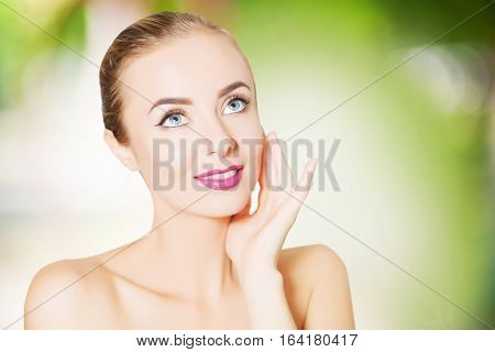 portrait of beautiful smiling woman with perfect skin