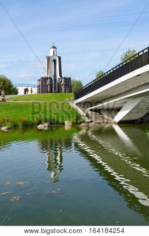 MINSK BELARUS - OCTOBER 1 2016: Unidentified people visit memorial complex "Monument to soldiers-internationalists" on Island of Tears Minsk Belarus