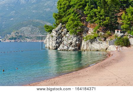 MILOCER MONTENEGRO - SEPTEMBER 17 2015: Unidentified people are relaxing on famous beach on Budva coast near island of Sveti Stefan Montenegro