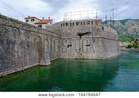 Fortress wall of bastion Bembo (1540) near river Shkurda Old town of Kotor Montenegro