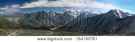 Panorama of the Altai Mountains with snowcaps. View from the highland pass Karaturek.