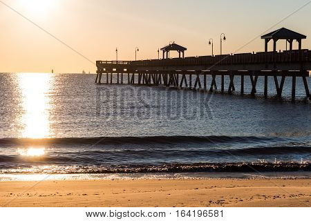 Fishing pier at sunrise, Buckroe Beach in Hampton, Virginia.