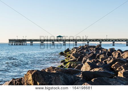 Buckroe Beach with fishing pier and rock jetty in Hampton, Virginia.