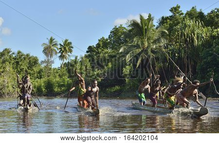 Indonesia, Irian Jaya, Asmat Province, Jow Village - June 23: Canoe War Ceremony Of Asmat People. He