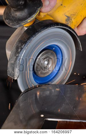 Cutting Steel With Angle Grinder At Car Service