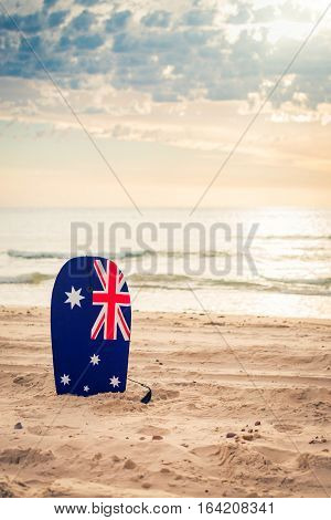 Surfing board with Australian flag at the beach