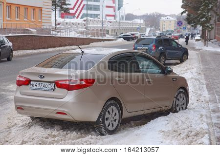 SARANSK, RUSSIA - JANUARY 6, 2017: Kia Rio sedan parked on city street. Photo taken at cloudy day.