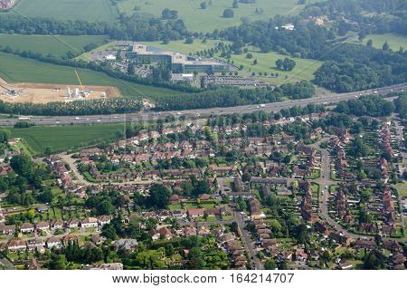 Aerial view across the Berkshire village of Datchet across the M4 motorway towards Ditton Park and the headquarters of CA Technologies. Sunny morning Summer.