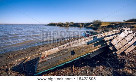 old wooden fishing boat in the lake Paliastomi Poti Georgia.