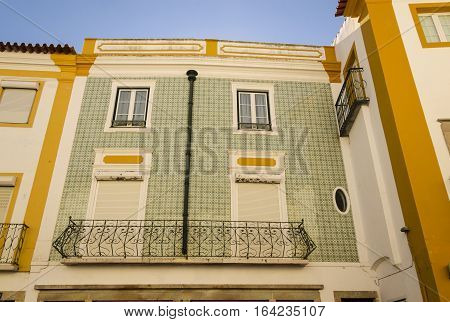 typical portugues palace with a facade full of tile evora portugal