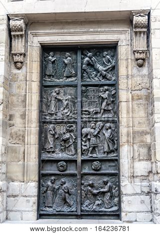 Paris France. Bronze gate works by the Italian master Tommaso Dzhismondy in the Church of St. Peter in Montmartre.