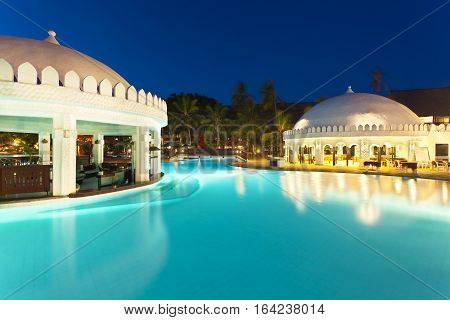 Diani Beach Kenya - February 17: Restaurant and illuminated pool landscape in the Southern Palms Beach Resort at night on February 17 2013