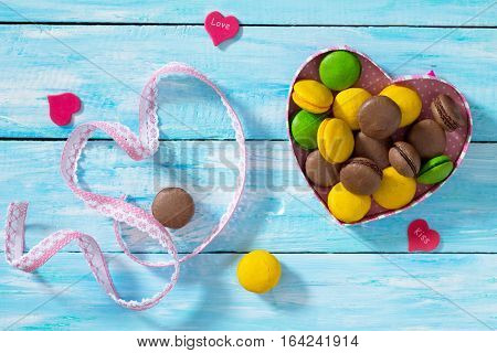 Background Valentine's Day. Valentine's Day Or Birthday Gifts Makarons Cake With Heart On A Blue Woo