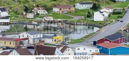 Small village community, Twillingate, Newfoundland.  Fishing boats docked along the shoreline in this coastal town, local roads connect the community along the Island's edges.