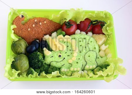 The dinosaur is made of rice. Creative food for good mood and appetite. Kyaraben, bento