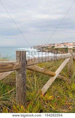 Landscape Coastline With Wooden Fance And Plants