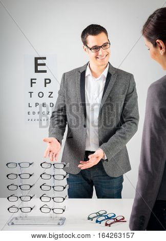 Customer trying new glasses at the optician's.