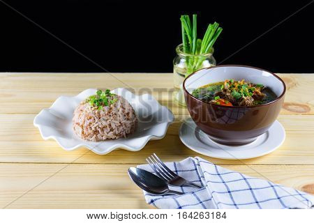 Soup with beef vegetables bone broth as base and boiled rice