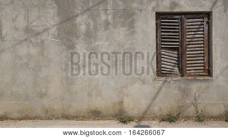 Wall with wooden window as a background