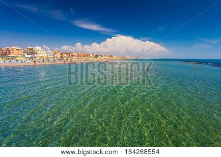 Lido di Ostia, ITALY - September 14 2016: Swimming and relaxing people on the beautiful beach Lido di Ostia ( Lido di Roma) private beach Battistini Italy.