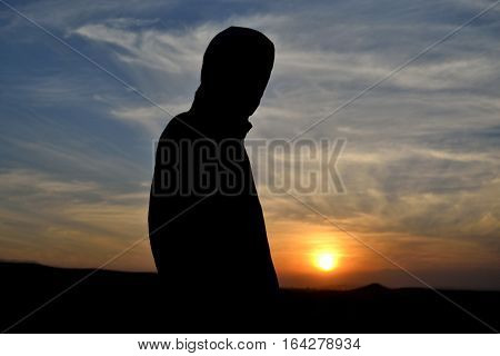 the silhouette photography and the sun sitting