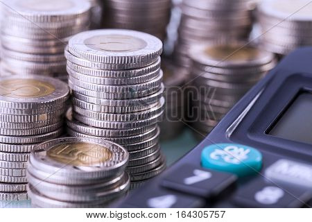 Couns And Calculator On White Background