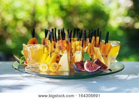 ish of cheese dried apricots and honey. The concept of food and catering.