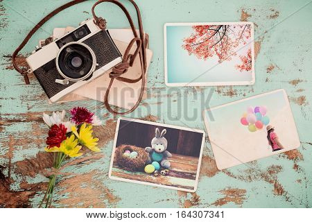 Photo album in remembrance and nostalgia of Happy easter day in spring on wood table. instant photo of vintage camera - vintage and retro style