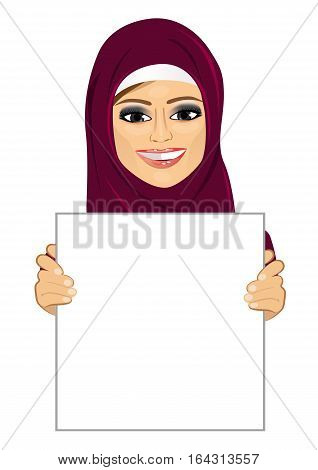 modern arabic woman wearing hijab holding an empty blank board
