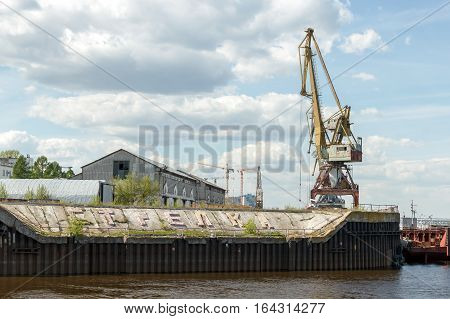 Strelka Nizhny Novgorod. Port cranes and buildings of the cargo river port. View from the Volga River
