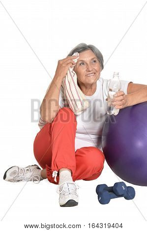 mature woman doing exercises, at the gym