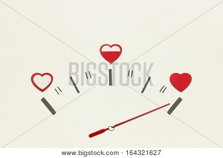 Creative valentines concept photo of speedometer with hearts on grey background.