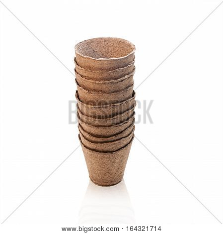 Empty peat pots for seedlings plants isolated on white background
