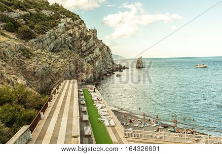 Detached private beach on the southern coast of Crimea. Foto with retro effect
