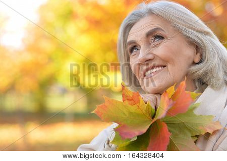 close up portrait of mature woman in autumn