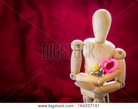 Still Life Wooden Puppet And Pink Heart.