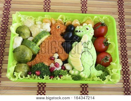 The dinosaur is made of rice. Kyaraben, bento. Creative food for children