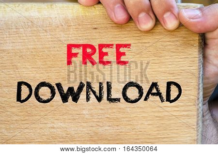 Human hand over wooden background and free download text concept