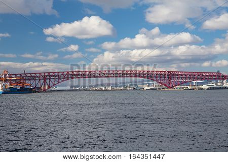 Minato Bridge over seacoast skyline and blue sky background in Osaka Japan