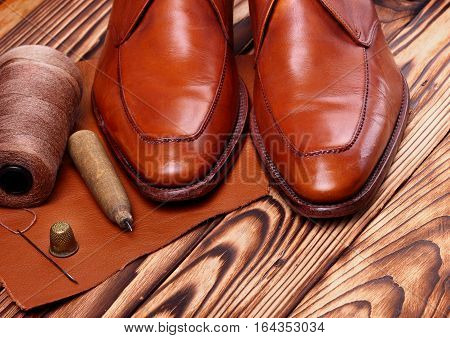 Fashion Derby Shoes Handmade And Shoemaker Tools Awl, Nails, Skien Of Thread .wooden Background.copy