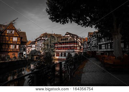 Historic old town half-timber houses on street at river Ill in Petite France district in Strassburg, Alsace, France