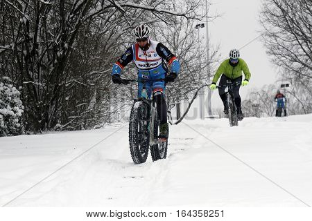 BUCHAREST ROMANIA - January 07 2017: Ice Biking on the hills covered with fresh snow in the central park in a winter day during the vacation.